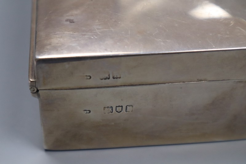 Two silver mounted cigarette boxes, including late 1950s, largest 14.1cm, gross 31 oz.